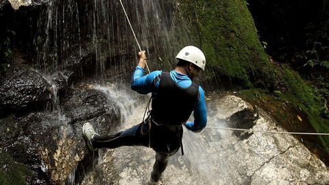 Canyoning  across a waterfall