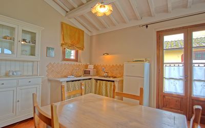 Tiglio: Room, Property, Furniture, Countertop, Floor, Building, Ceiling, Cabinetry, Kitchen, Wood Flooring