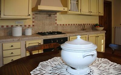 Piero della Francesca: Room, Countertop, Property, Kitchen, Cabinetry, Furniture, Floor, Interior Design, Tile, Flooring