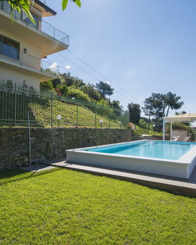 Delfina: Sky, Plant, Building, Swimming Pool, Tree, Shade, Lighting, Condominium, Grass, Rectangle