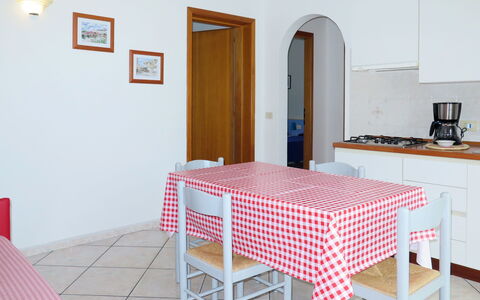 Capoliveri 675: Room, Furniture, Property, Table, Bedroom, Floor, Pink, Interior Design, Dining Room, Tablecloth