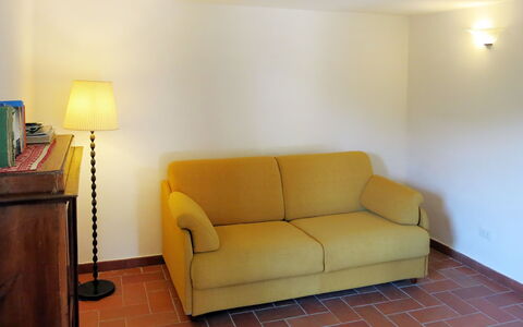 L'Uccelliera: Furniture, Room, Couch, Property, Floor, Sofa Bed, Yellow, Interior Design, Wall, Comfort