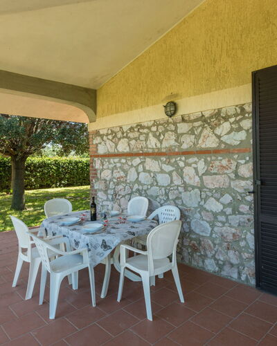 Podere Chiocciolaia: Plant, Property, Chair, Table, Shade, Building, Wood, Interior Design, Flooring, Floor