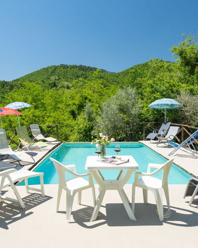 Il Castagneto: Sky, Furniture, Table, Plant, Umbrella, Chair, Outdoor Furniture, Swimming Pool, Outdoor Table, Shade