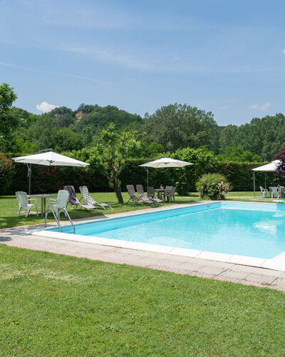 Il Fienile del Casolare: Plant, Water, Sky, Swimming Pool, Cloud, Tree, Shade, Rectangle, Umbrella, Outdoor Furniture