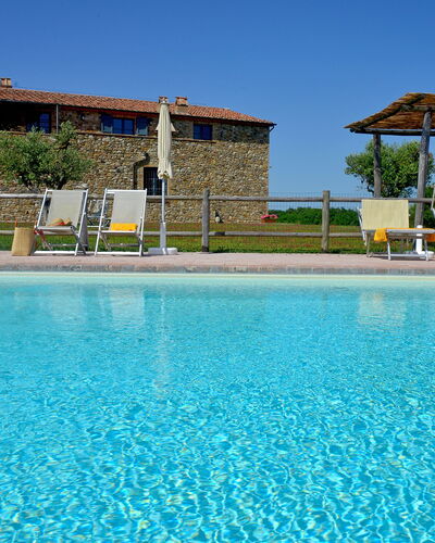 Villa Guardistallo: Water, Sky, Plant, Azure, Swimming Pool, Tree, Building, Leisure, Aqua, Real Estate