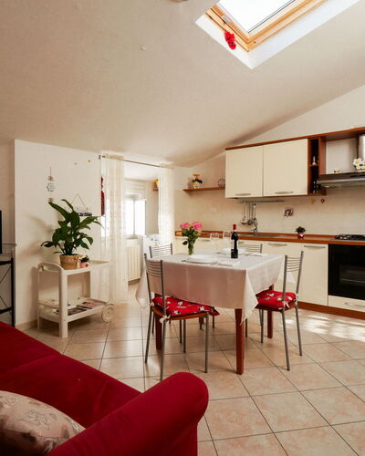 Stefi: Furniture, Property, Plant, Cabinetry, Wood, Houseplant, Couch, Orange, Building, Countertop