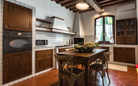 Le Due Ville: Countertop, Cabinetry, Furniture, Property, Kitchen, Wood, Window, Lighting, Chair, Kitchen Appliance