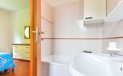 Terrazza di Paolo: Bathtub, Plumbing Fixture, Building, Blue, Tap, Bathroom, Cabinetry, Wood, Drawer