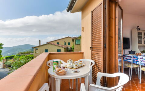 Terrazza di Paolo: Sky, Table, Property, Furniture, Building, Wood, Cloud, Plant, Chair, Architecture