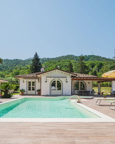 Versilia Holiday: Sky, Plant, Property, Water, Swimming Pool, Tree, Building, Shade, Grass, Eco Hotel