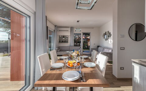 Villa Marzia Mare & Golf: Table, Furniture, Property, Chair, Wood, Picture Frame, Interior Design, Living Room, Flooring