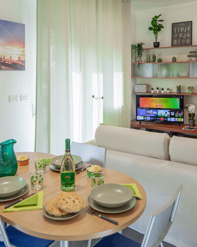 Apartment Serena - Levanto: Table, Furniture, Property, Couch, Azure, Interior Design, Shelf, Architecture, Picture Frame, Tableware