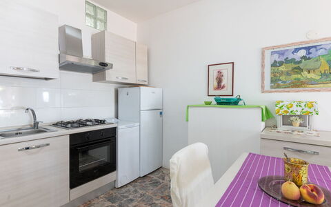La Pineta: Property, Cabinetry, Countertop, Picture Frame, Kitchen Stove, Kitchen Appliance, Interior Design, Purple, Gas Stove, Wood