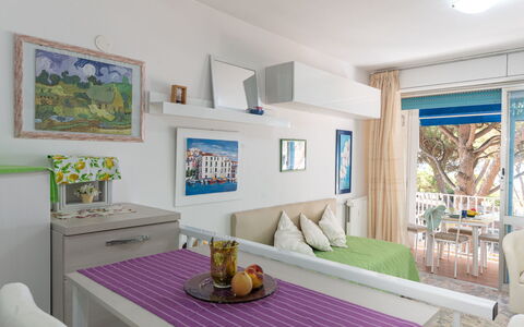 La Pineta: Table, Furniture, Picture Frame, Property, Azure, Comfort, Window, Purple, Interior Design, Cabinetry