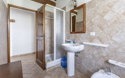 Apartment Terrazza: Mirror, Tap, Sink, Plumbing Fixture, Property, Bathroom Sink, Bathroom, Building, Wood, Purple