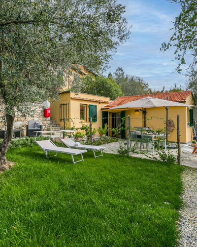 Villa Anna: Table, Furniture, Flower, Property, Cloud, Sky, Plant, Building, Chair, Shade