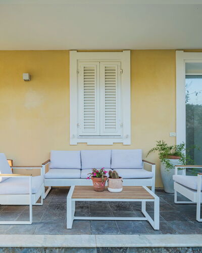 La Casa dei Limoni di Valeria: Furniture, Couch, Property, Table, Plant, Azure, Comfort, Houseplant, Shade, Flowerpot