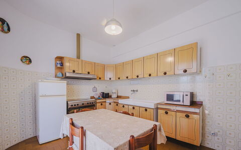 Daniela: Cabinetry, Property, Countertop, Table, Wood, Kitchen, Kitchen Appliance, Chair, Flooring, Interior Design