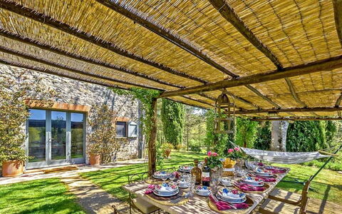 Villa Aiola: Resort, Shade, Eco Hotel, Garden, Backyard, Landscaping, Chair, Natural Material, Yard, Farmhouse