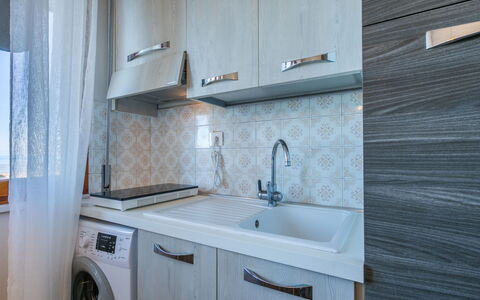 Mediterraneo: Countertop, Major Appliance, Flooring, Plumbing Fixture, Interior Design, Wood, Sink, Floor, Kitchen, Tap