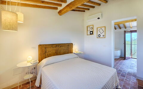 Villa Marielena Chianti Farmhouse with Hot Tub: Wall, Interior Design, Bedroom, Flooring, Home, Floor, Bed, Ceiling, Furniture, Room