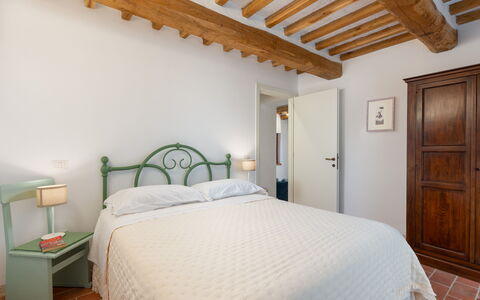 Villa Marielena Chianti Farmhouse with Hot Tub: Wall, Bedroom, Furniture, Bed, Interior Design, Ceiling, Floor, Flooring, Bedding, Bed Sheet