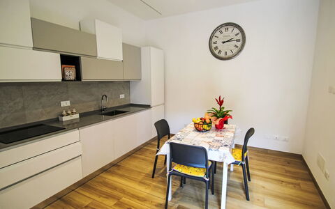 Via Nazionale: Furniture, Interior Design, Flooring, Floor, Wood, Kitchen, Countertop, Room, Cabinetry, Wood Flooring