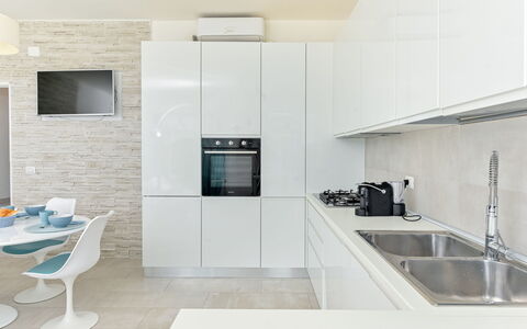Sabrina: Countertop, Kitchen, Flooring, Interior Design, Wall, Cabinetry, Kitchen Appliance, Floor, Wood, Furniture