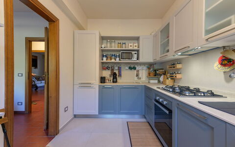 Casamare: Kitchen, Kitchen Appliance, Major Appliance, Countertop, Cabinetry, Interior Design, Flooring, Furniture, Kitchen Stove, Home Appliance