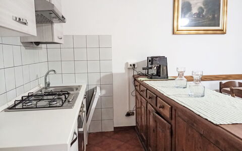 Casa Laura: Flooring, Kitchen, Wood, Countertop, Furniture, Interior Design, Major Appliance, Cabinetry, Floor, Kitchen Appliance