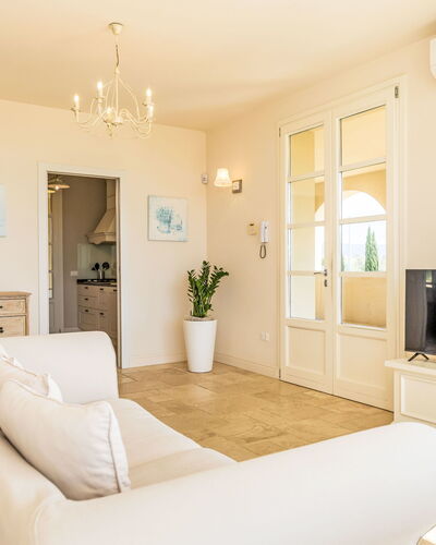 Villa Gli Olivi: Furniture, Interior Design, Flooring, Floor, Wood, Ceiling, Room, Couch, Apartment, Living Room