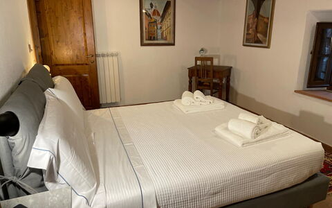 Borgo Antico, Pool, Barberino del Mugello: Bedroom, Bed, Wood, Bed Sheet, Bedding, Furniture, Interior Design, Bed Frame, Room, Floor