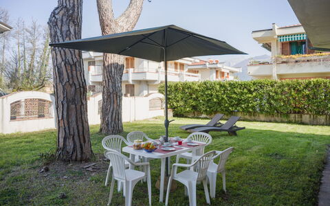 Grande Appartamento: Umbrella, Shade, Outdoor Furniture, Lawn, Garden, Outdoor Table, Chair, Landscaping, Yard, Eco Hotel