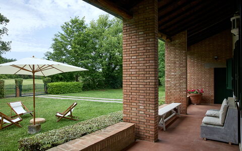 Casa Mancini, Holiday Villa, San Galgano: Shrub, Garden, Brick, Furniture, Lawn, Outdoor Furniture, Groundcover, Estate, Backyard, Shade