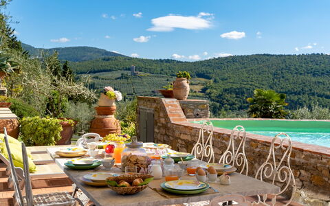 Torre al Poggio 8: Furniture, Table, Chair, Kitchen & Dining Room Table, Outdoor Furniture, Outdoor Table, Flowerpot, Tablecloth, Garden, Houseplant