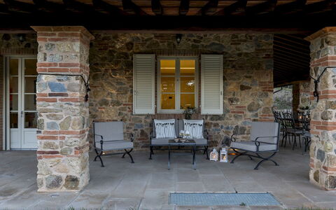 Villa Dada 10: Furniture, Door, Outdoor Furniture, Chair, Porch, Brick, Flagstone, Shade, Patio, Stone Wall