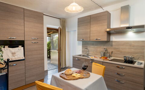 Il Pratone 12: Kitchen, Countertop, Wood, Kitchen Appliance, Interior Design, Major Appliance, Cabinetry, Flooring, Furniture, Kitchen Sink