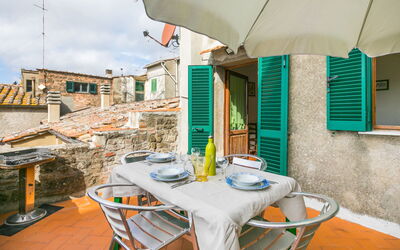 Montecatini Val Di Cecina 100: Property, Furniture, Table, Building, Azure, Chair, Sky, Wood, Cloud, Architecture