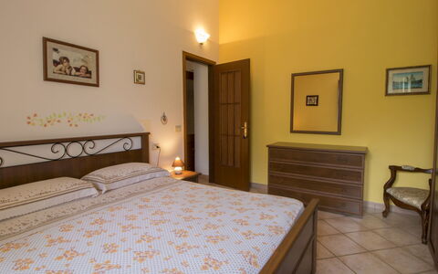 Sunflower: Bedroom, Room, Property, Bed, Furniture, Bed Sheet, Bed Frame, Floor, Interior Design, Building