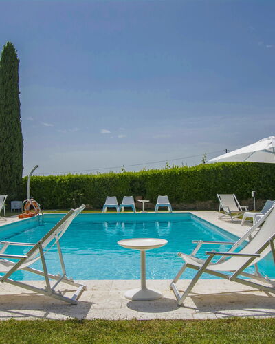 Aurelia: Water, Sky, Plant, Furniture, Azure, Shade, Outdoor Furniture, Rectangle, Sunlounger, Swimming Pool